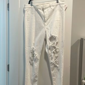 Brand new, never worn American Eagle ripped white pants, stretchy/skinny taper.